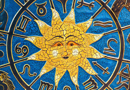 Zodiac signs in circle with golden sun